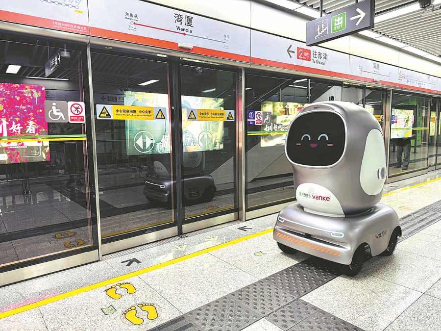 a Chinese robot is delivering goods at Shenzhen metro area.